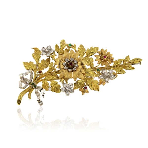 Spilla in oro bianco, simbolo di eleganza e raffinatezza senza tempo.